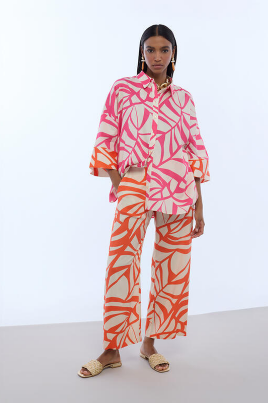 CALÇAS ESTAMPADAS LARANJA E CRU - LOLA CASADEMUNT