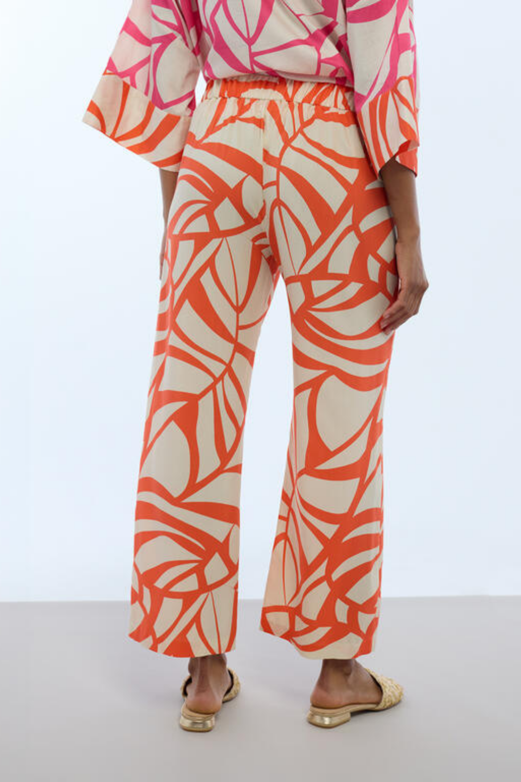 CALÇAS ESTAMPADAS LARANJA E CRU - LOLA CASADEMUNT